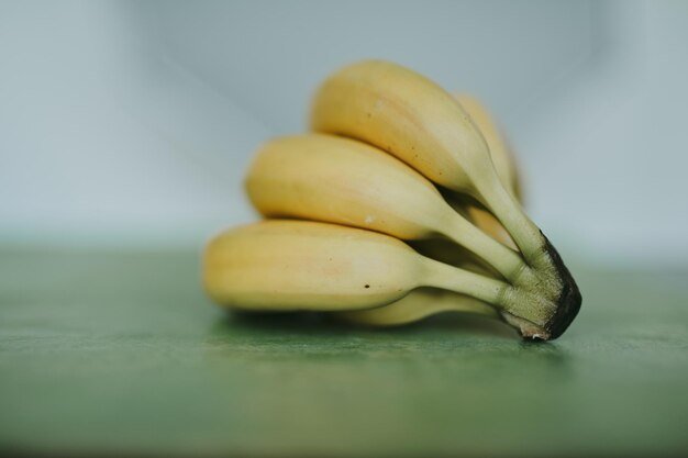 Closeup of bananas on green background
