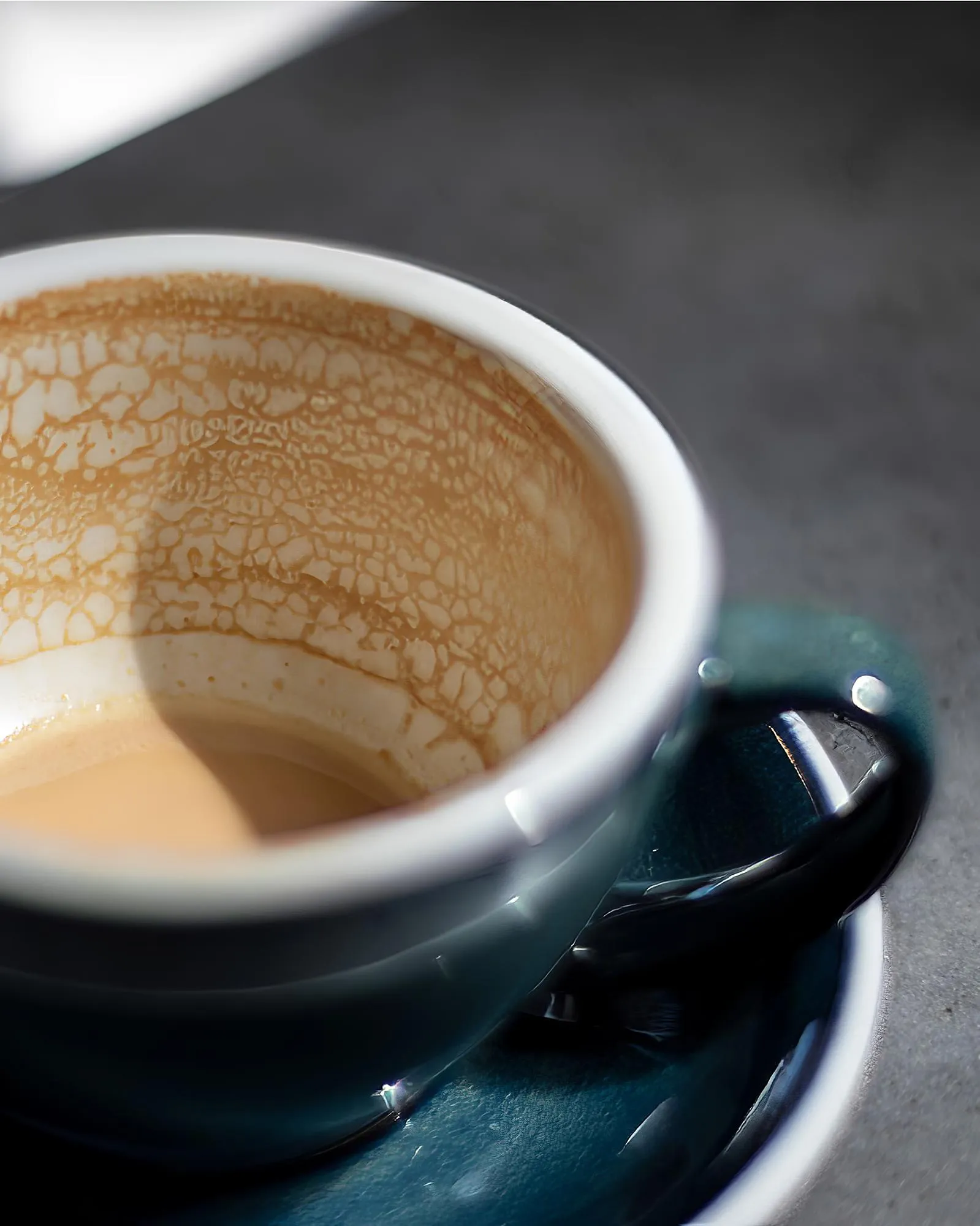 empty coffee cup patterns on coffee ceramic on concrete table and green ceramic cup