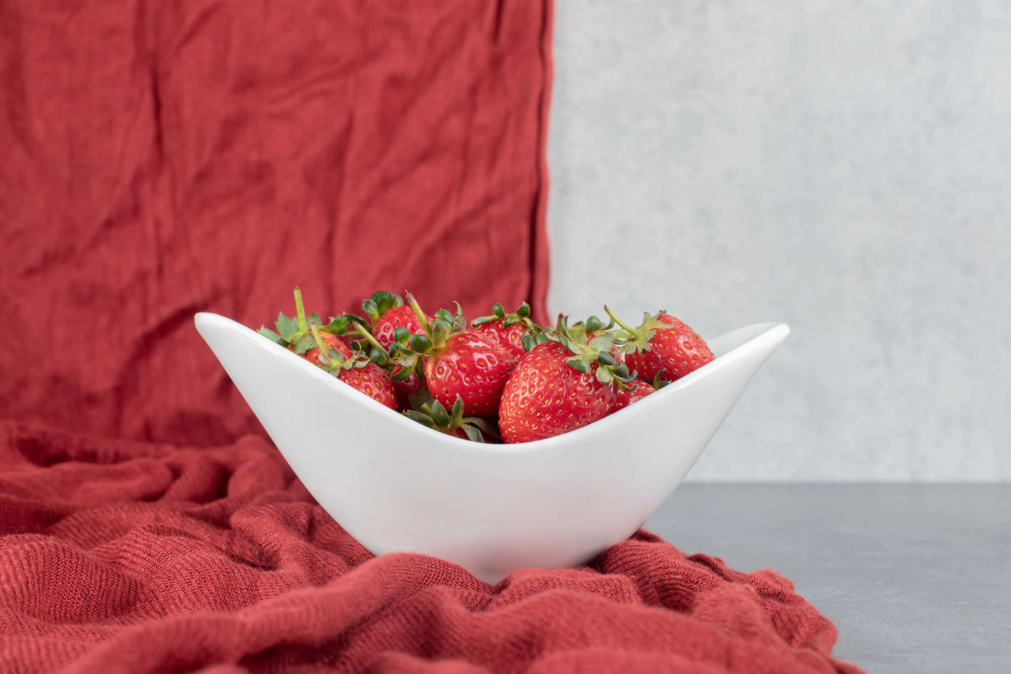 Fresh ripe strawberries in white bowl. High quality photo