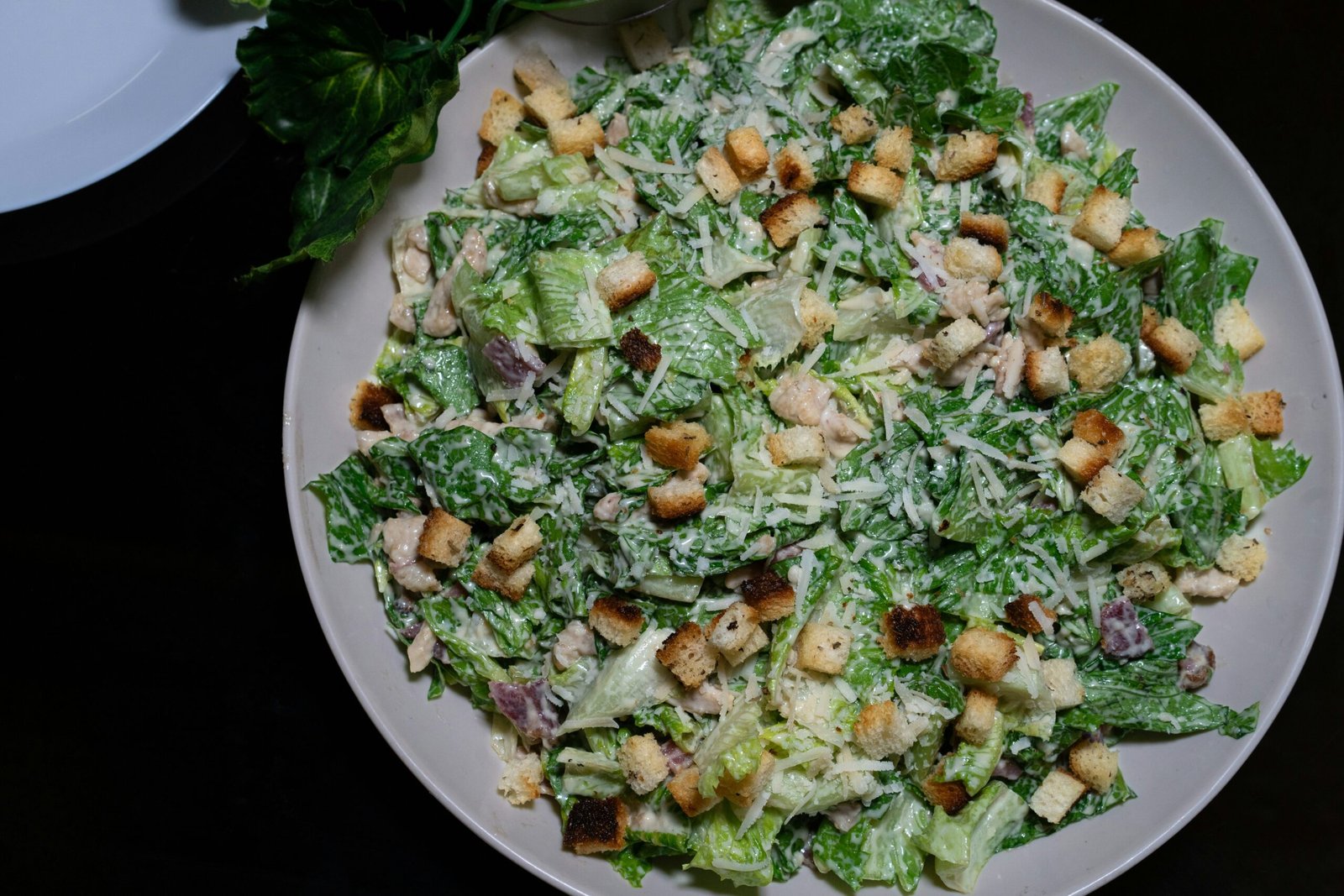 A delicious caesar salad, ready to be eaten!