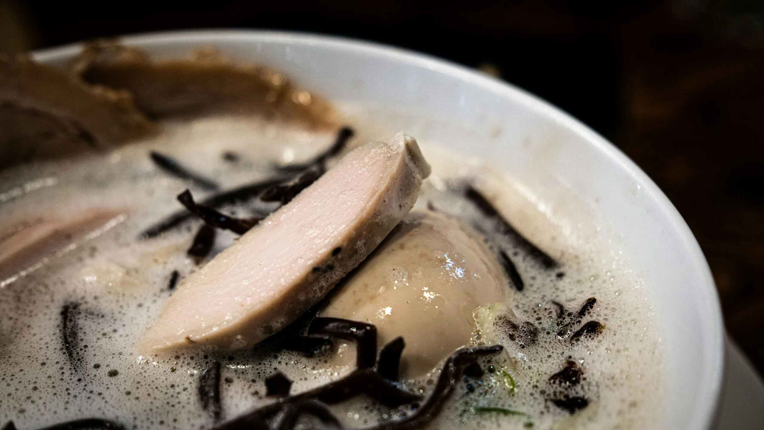 a close up of a bowl of food on a table