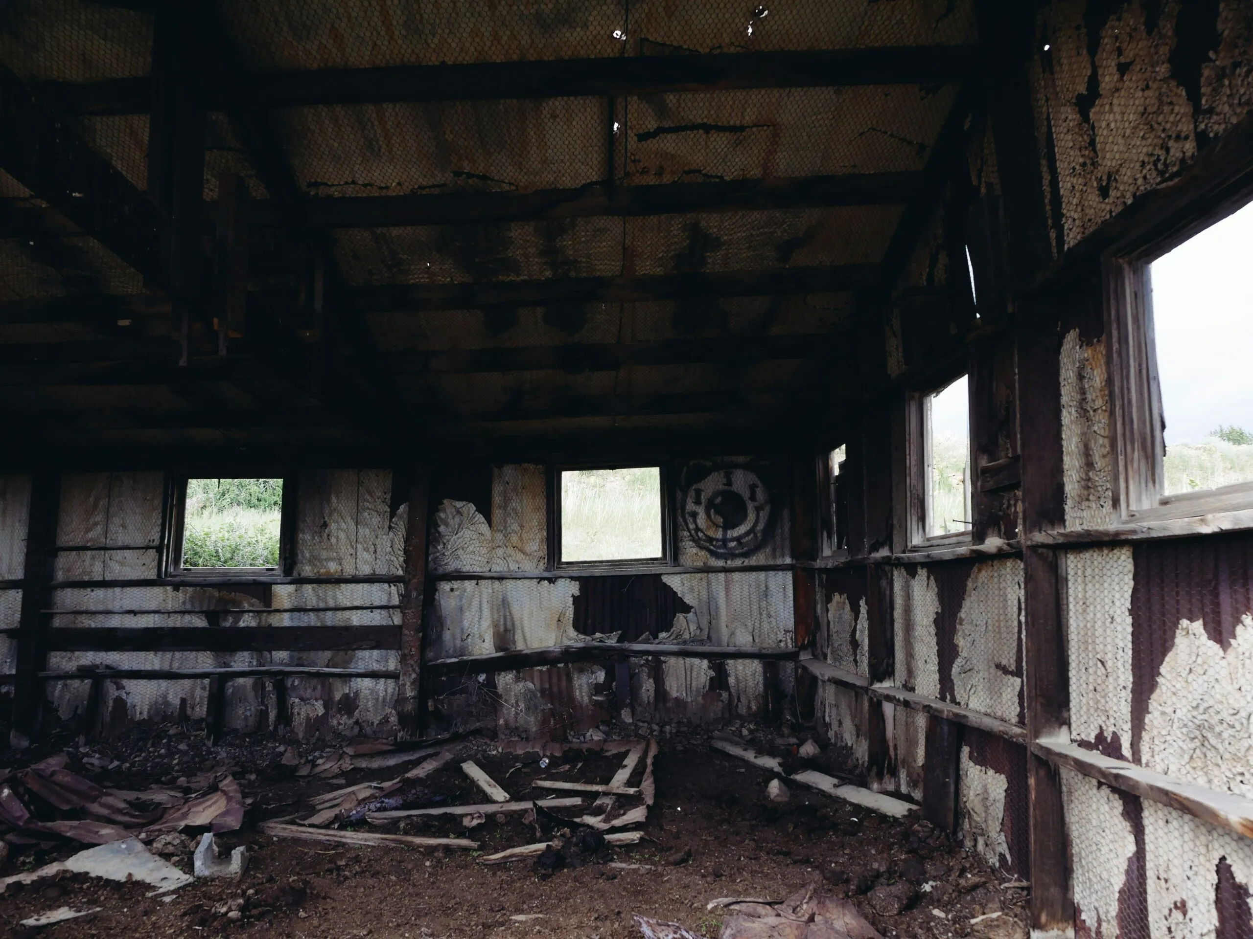 Inside an old, dilapidated, weathered building.