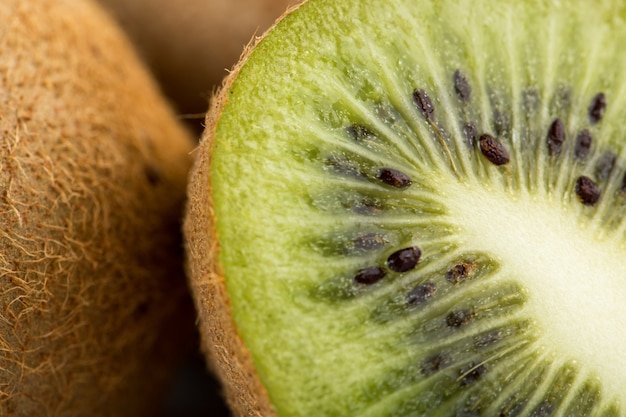 Kiwi brown fresh ripe mellow juicy isolated on white desk