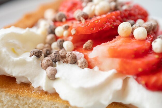 A beautiful dessert of sponge cake and cream with strawberries