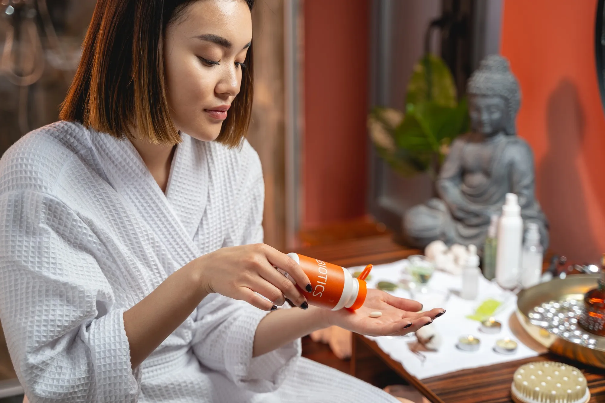 Calm lady using cosmetics in spa salon