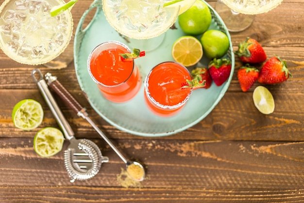 Classic lime and strawberry margaritas on the rocks.