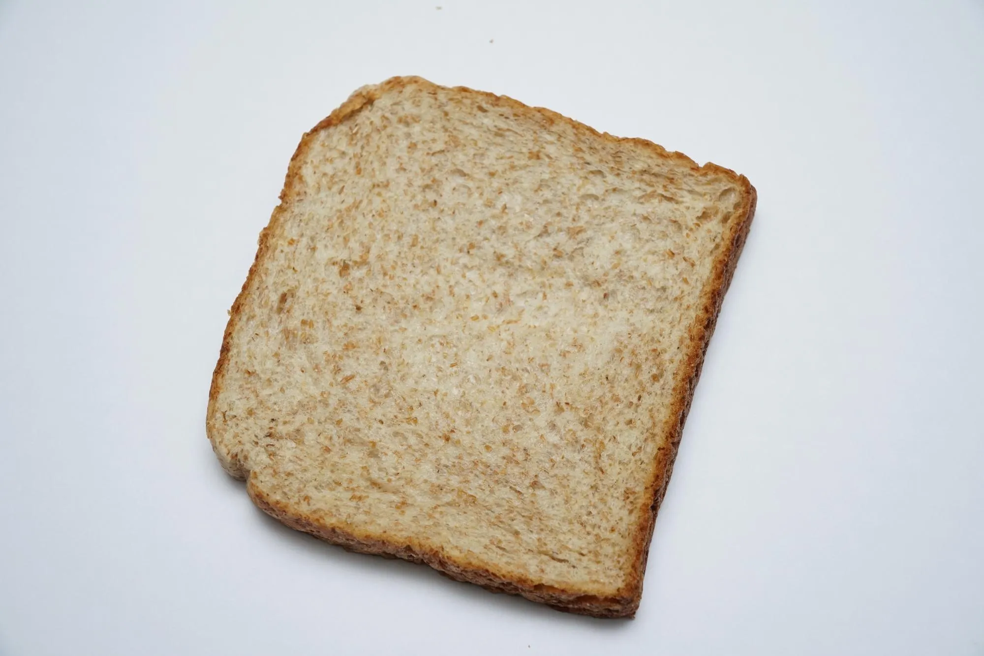 Close-up of bread against white background