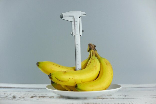 Close-up of fruits on table against white background