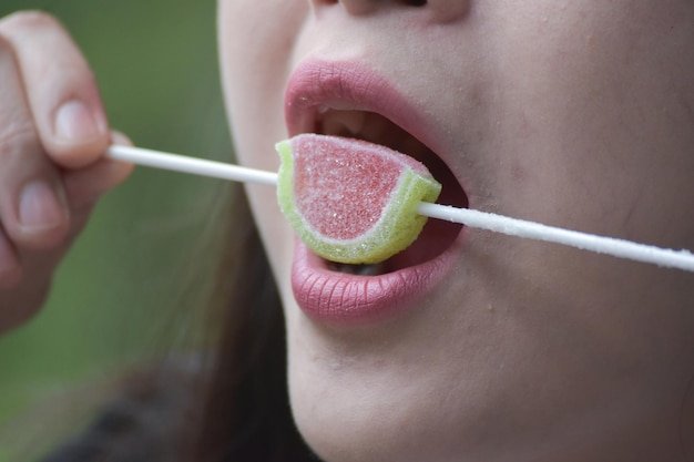 Closeup photo of food in mouth eating food
