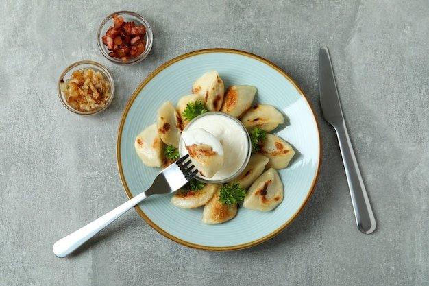 Concept of tasty food with vareniki or pierogi