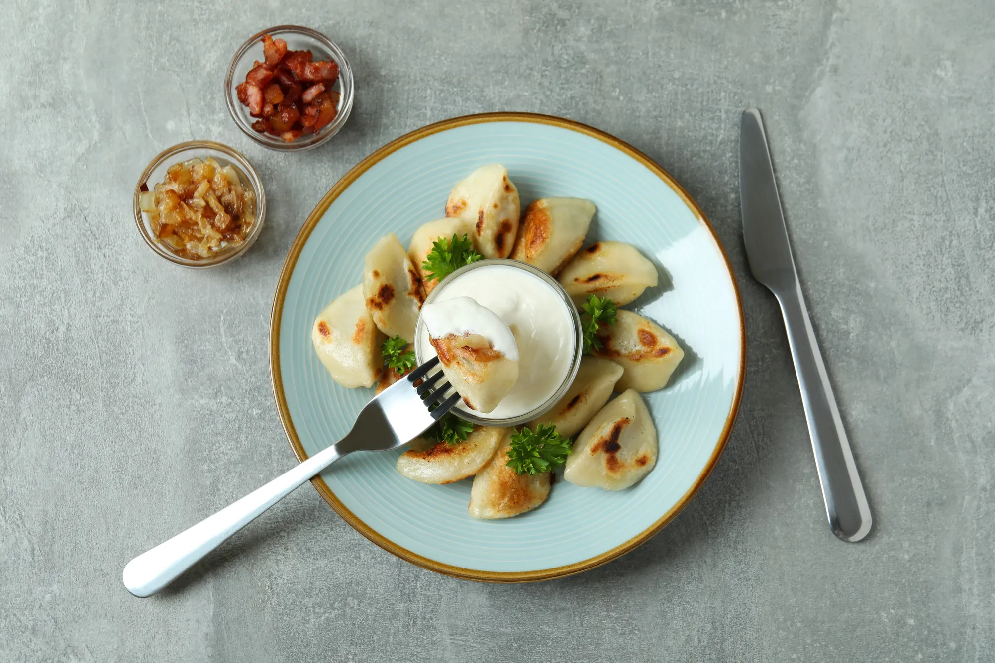 Concept of tasty food with vareniki or pierogi