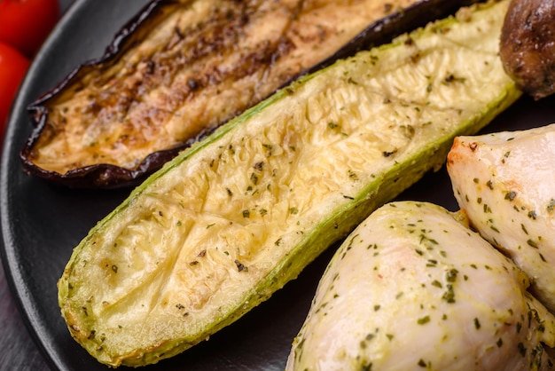 Delicious grilled vegetables zucchini eggplant peppers and mushrooms with salt spices and herbs