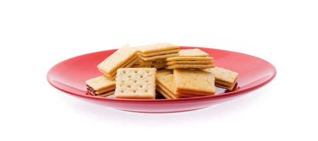 dish of Tasty biscuits isolated on white background