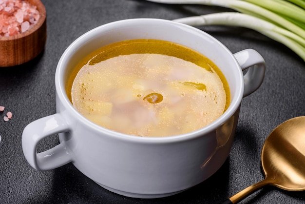 Fresh pea soup in bowl on black background Cooking at home