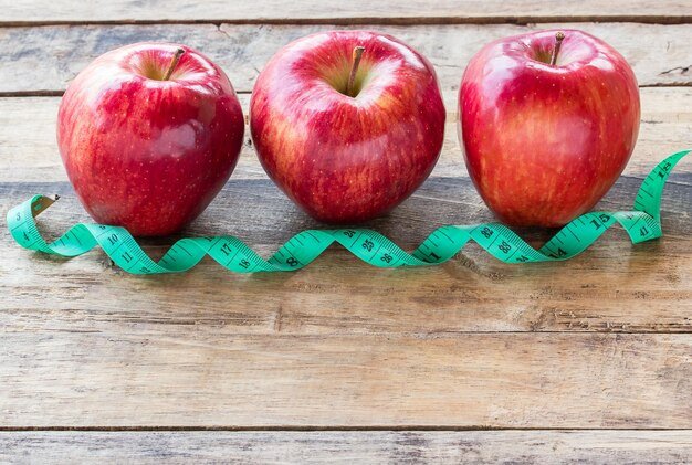 Fresh Red apple on wood table background Top view with copy space