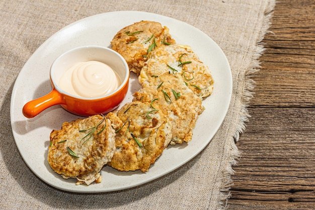 Hake fillet fried in batter Sauce fresh rosemary Vegetarian healthy food concept