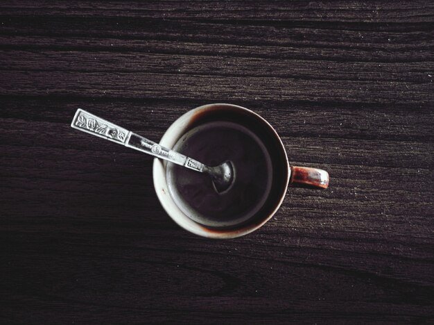 High angle view of black coffee on table