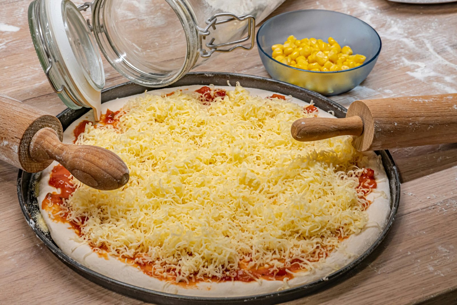 A pizza sitting on top of a pan covered in cheese