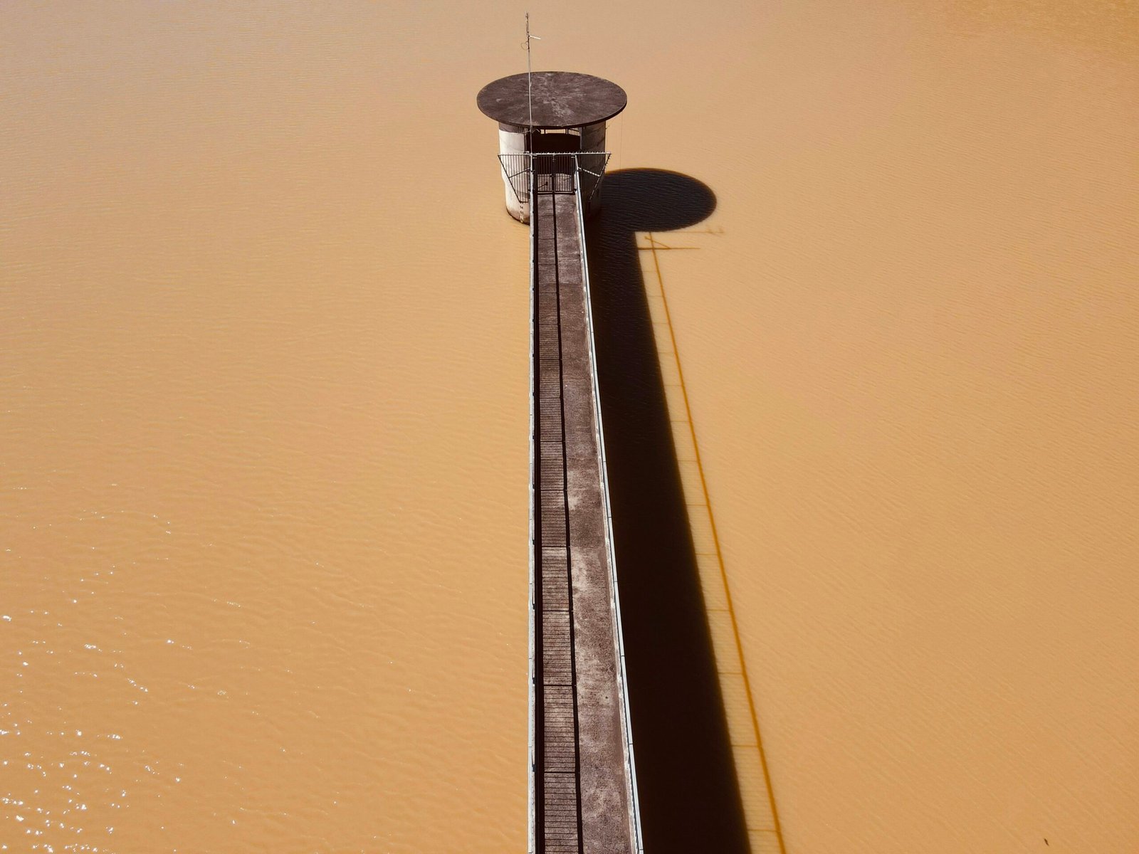 a boat dock in the middle of a body of water
