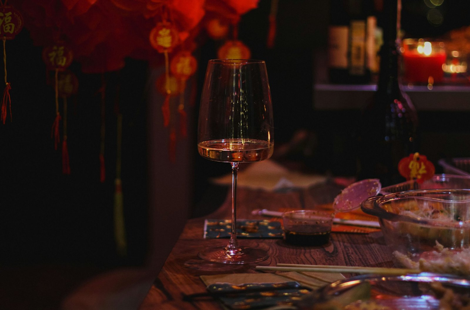 clear wine glass on brown wooden table