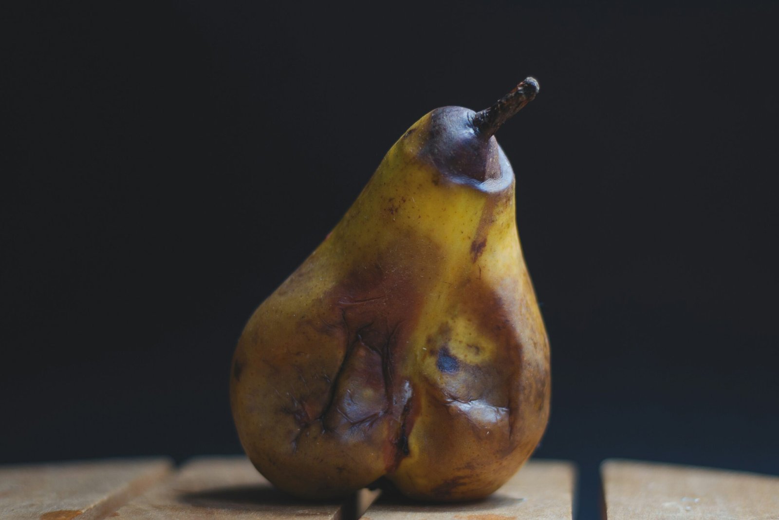 yellow fruit on brown wooden table