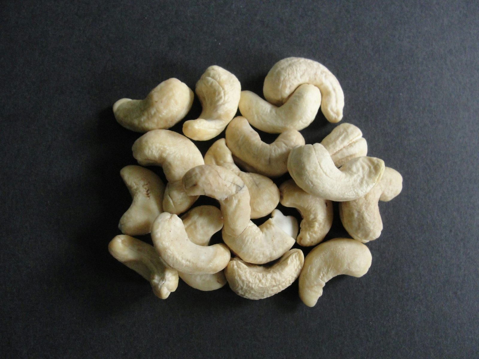 a pile of cashews sitting on top of a table