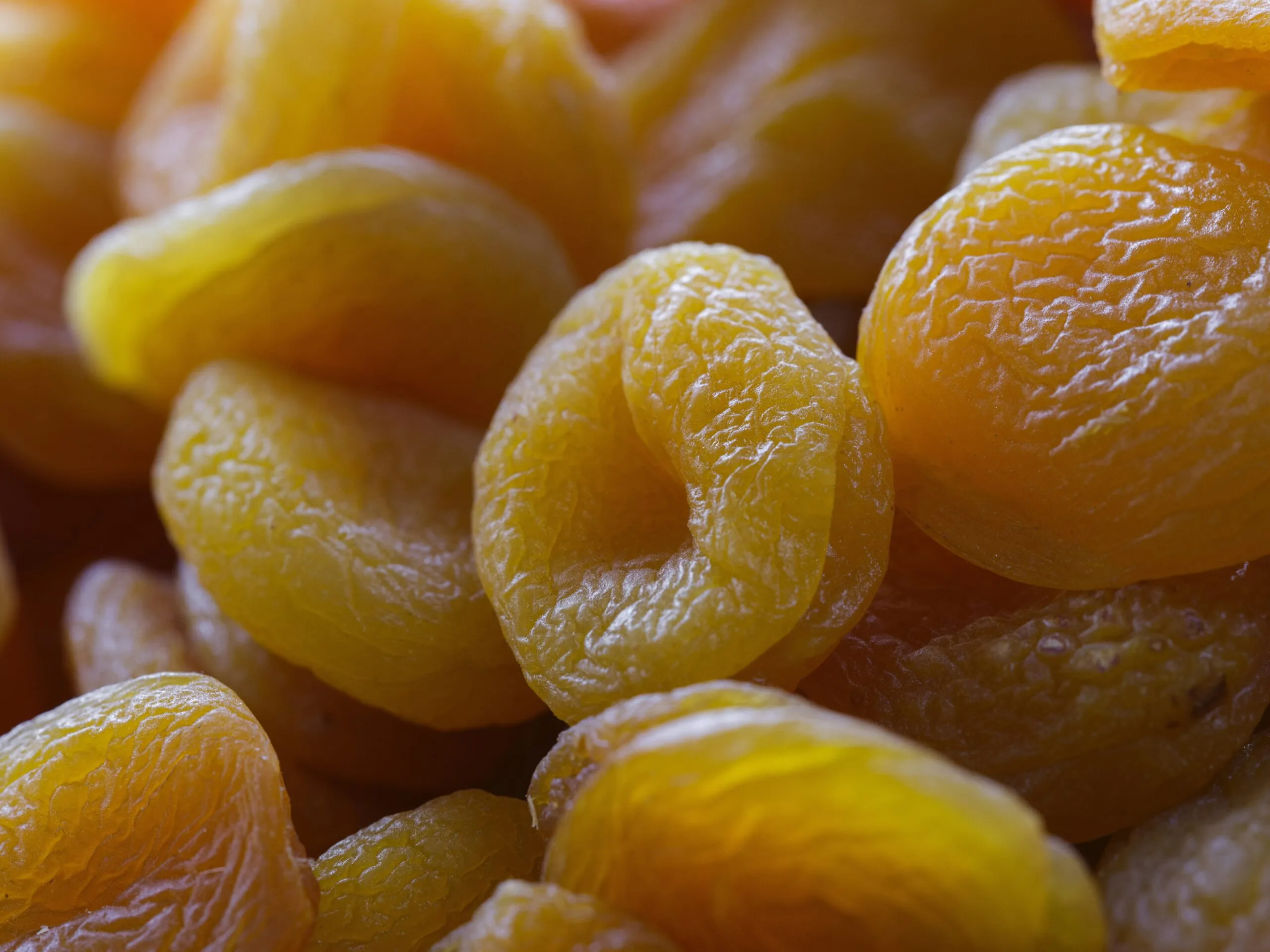 A pile of oranges sitting next to each other