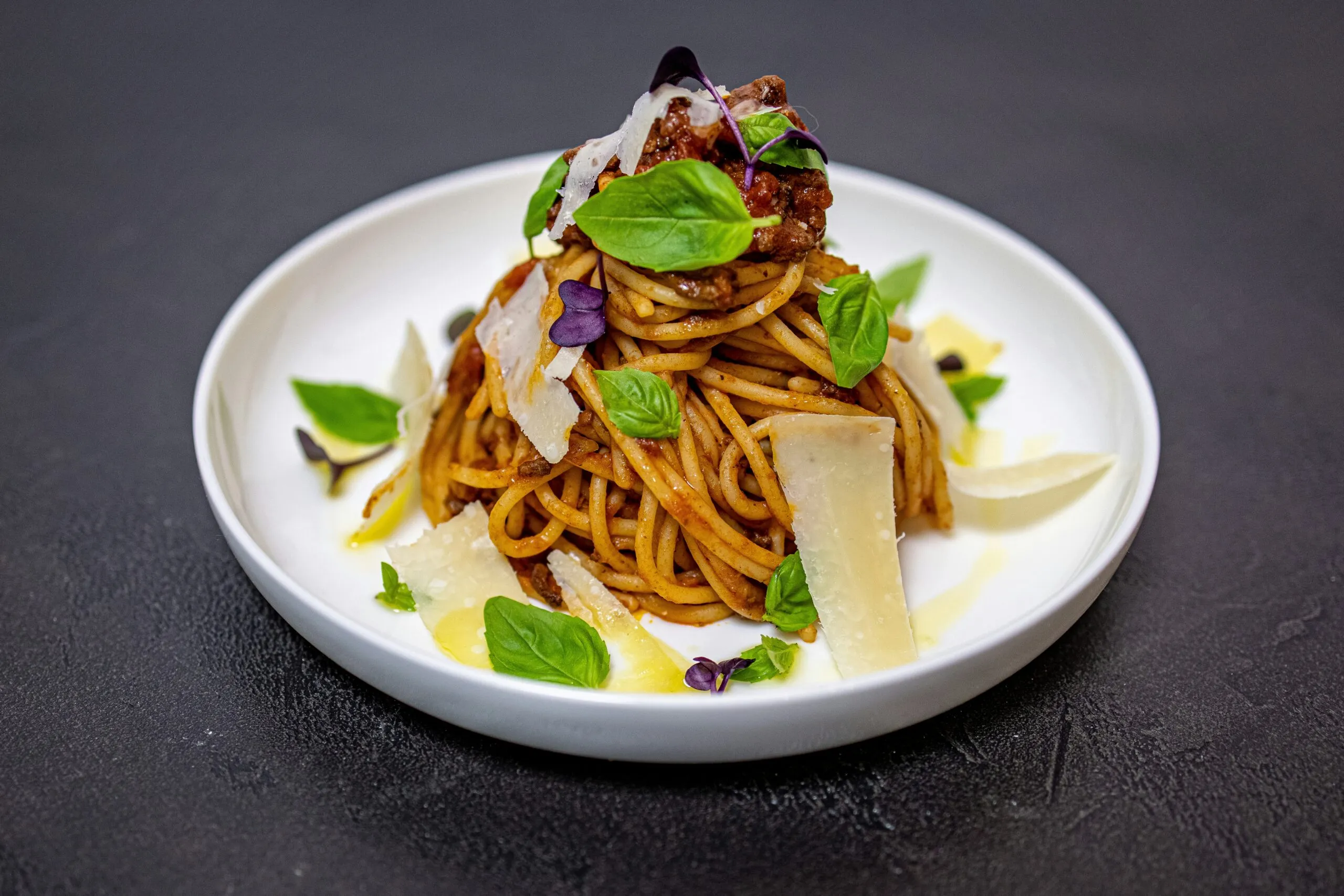 a white plate topped with pasta and vegetables