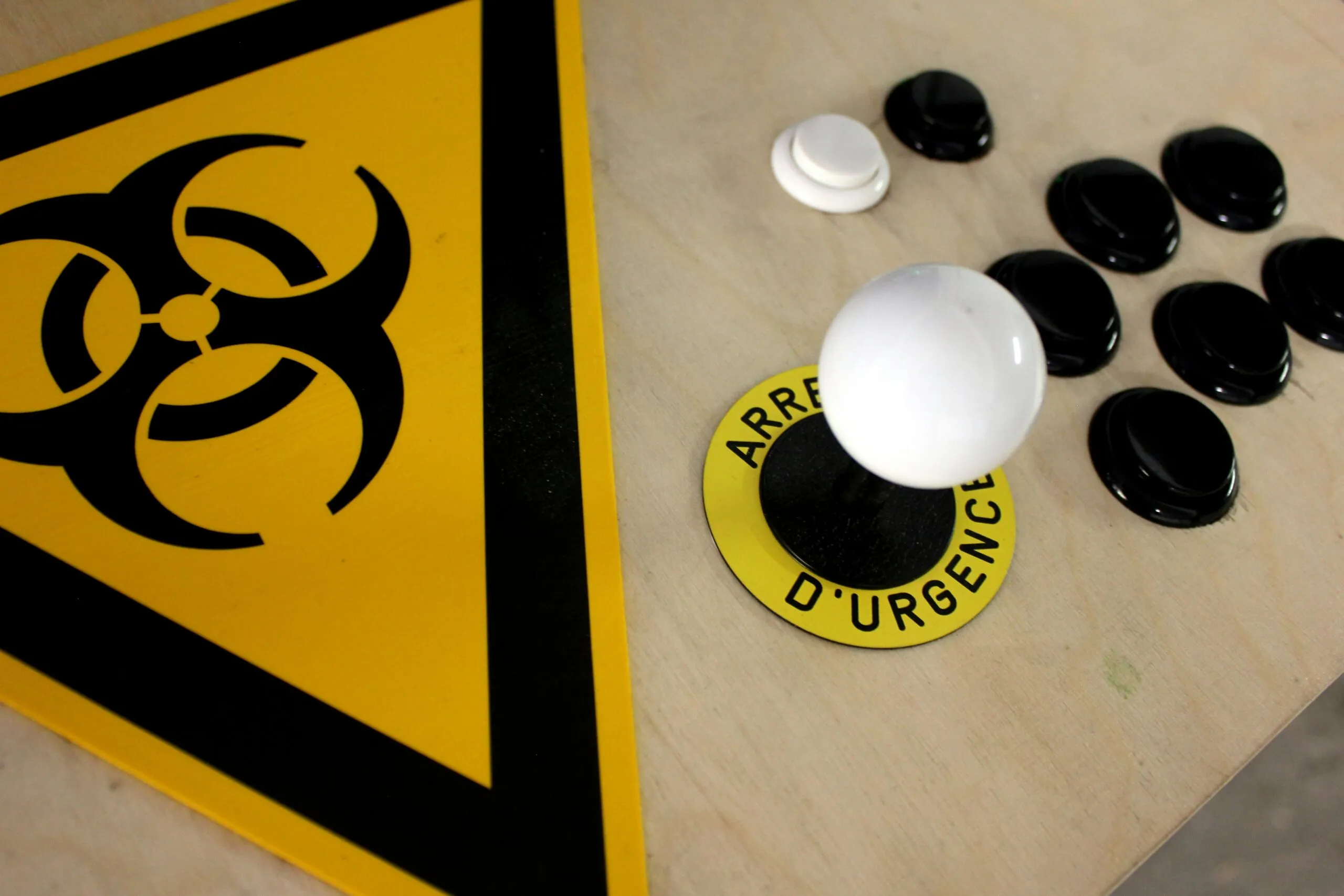 white round plastic on yellow and black textile