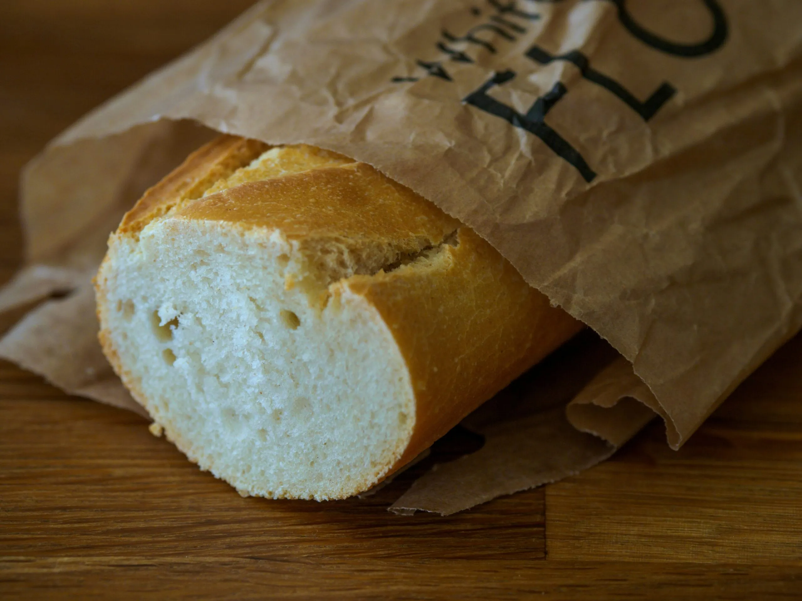 a loaf of bread sitting on top of a wooden table