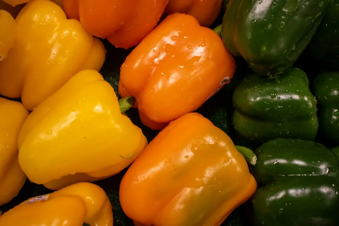 Colorful bell peppers are on display.