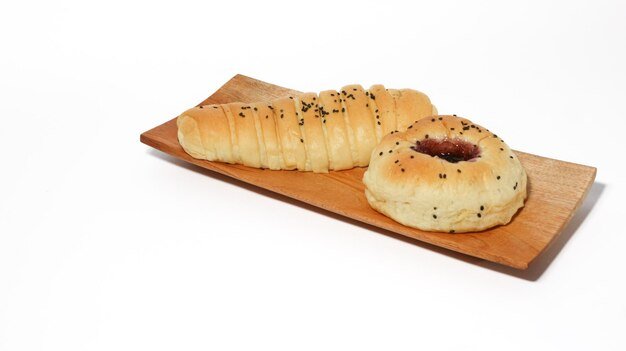 Indonesian bread filled with strawberries and chocolate banana bread isolated on white background S
