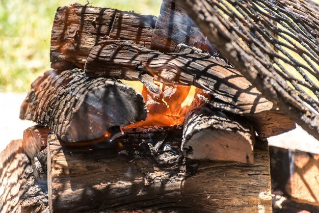 Logs set on fire to cook meat on the fire typical argentinian
