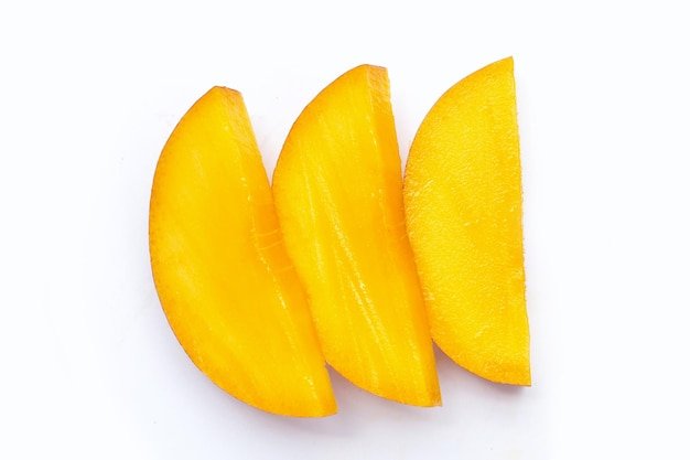 Mango fruit slices on white background
