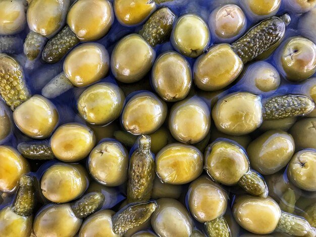 Olives stuffed with gherkins for sale at the open thursday market in javea alicante spain