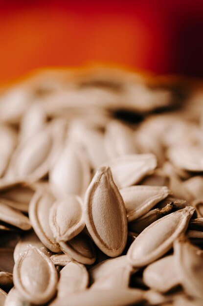 Pumpkin with removing the loose pulp and seeds closeup of pumpkin piece Pumpkin seeds and pulp after carving