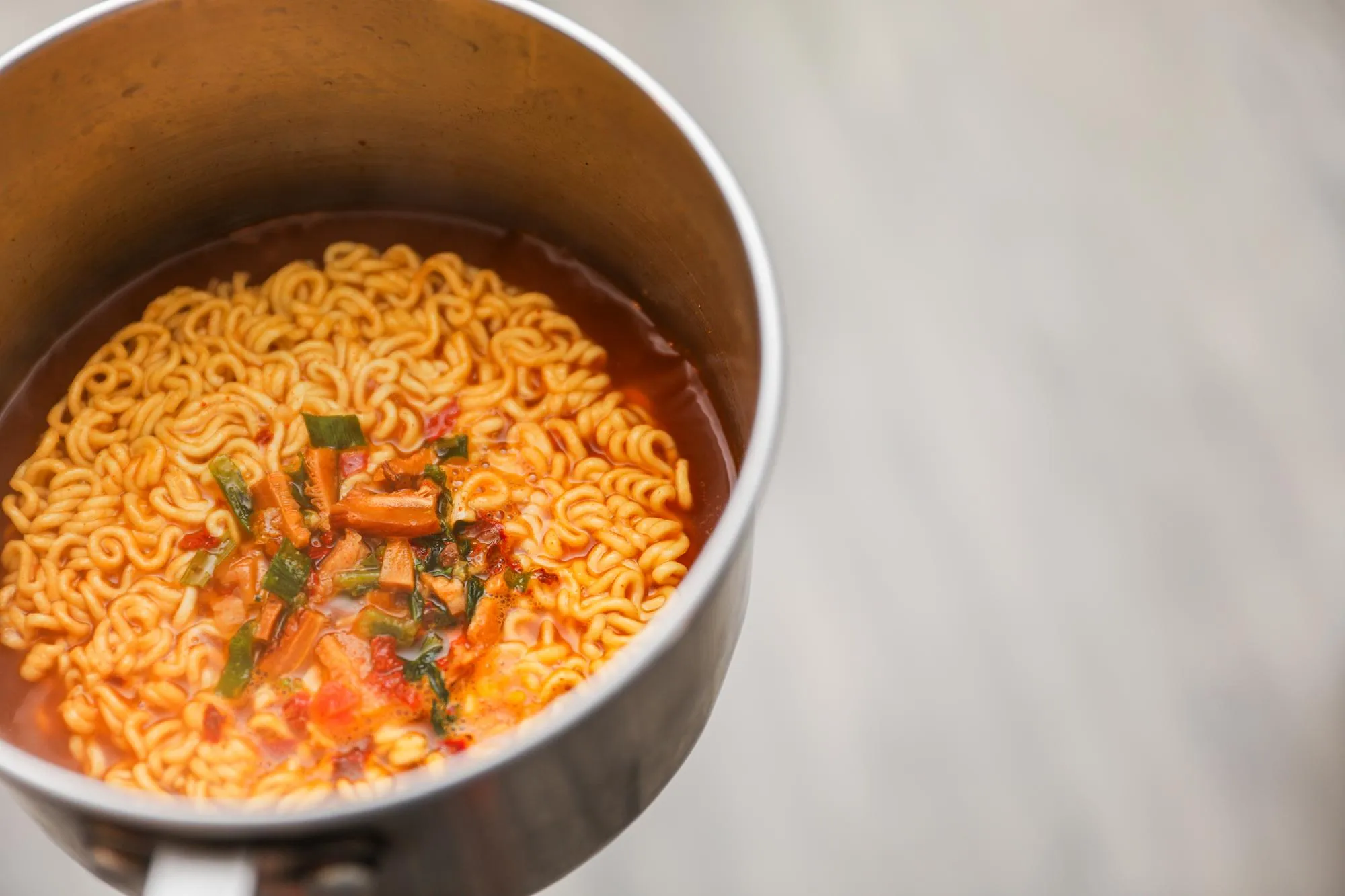 Ramen noodles a culinary icon simmering in cultural fusion Chopsticks poised for gastronomic jour