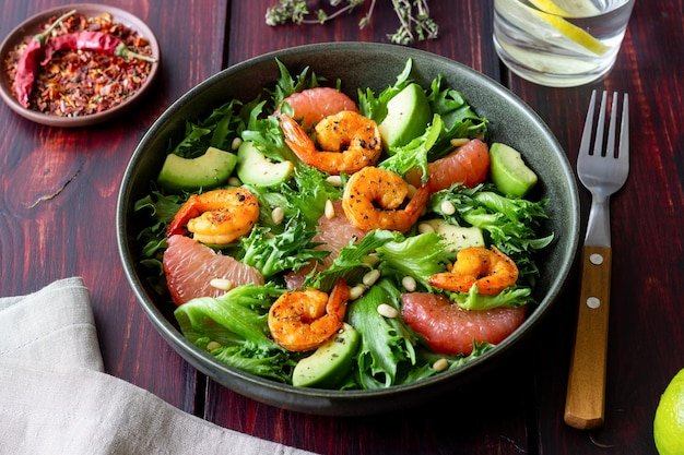 Salad with shrimp grapefruit avocado and nuts Healthy eating Diet