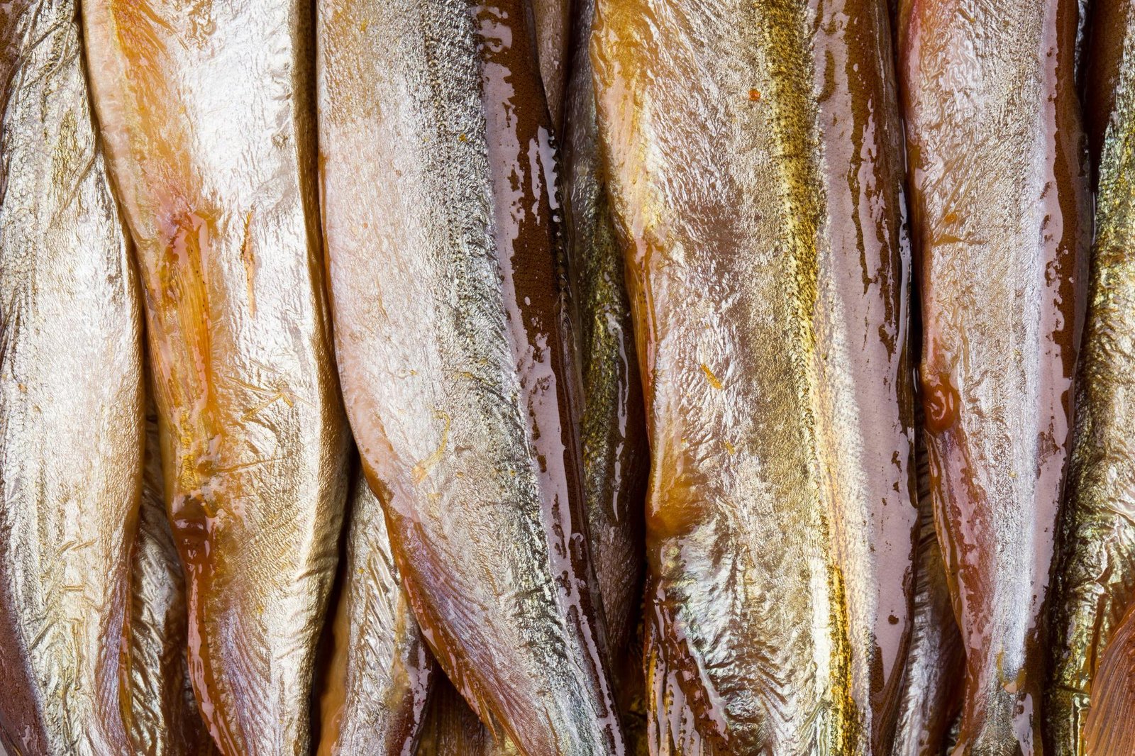 Smokedried fish close up Texture Whole background