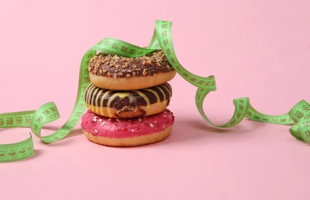 A stack of donuts with a measuring tape on a pink background Diet concept