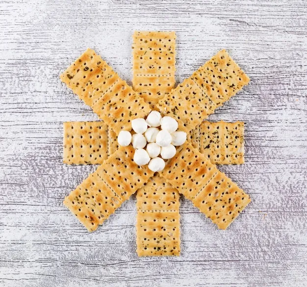 Top view crackers with mozzarella on white wooden horizontal