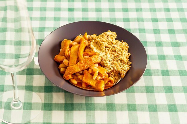 Traditional Tripe Dish with Beans and Crumbs Served on a Plate