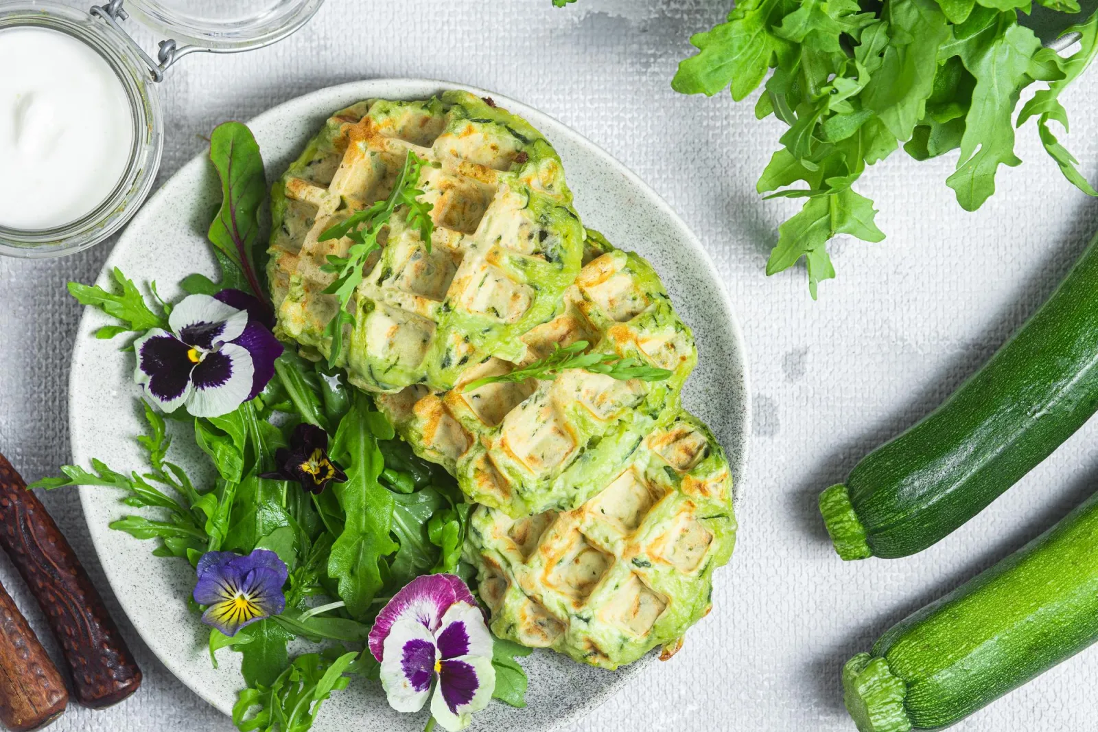 Zucchini waffles with arugula in a bowl