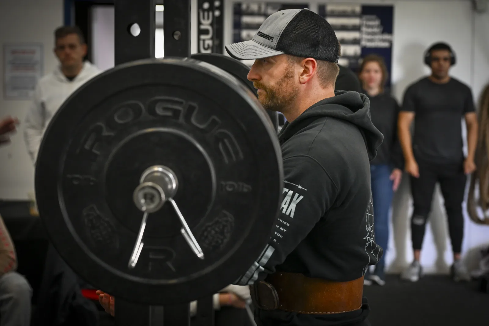 A participant of the Skelton Gym Powerlifting Competition prepares to squat at Spangdahlem Air Base, Germany, Sept. 13, 2025. The participants of the competition competed for personal best repetitions of squatting, deadlifting, and benching. (U.S. Air Force photo by Senior Airman Haiden Morris)