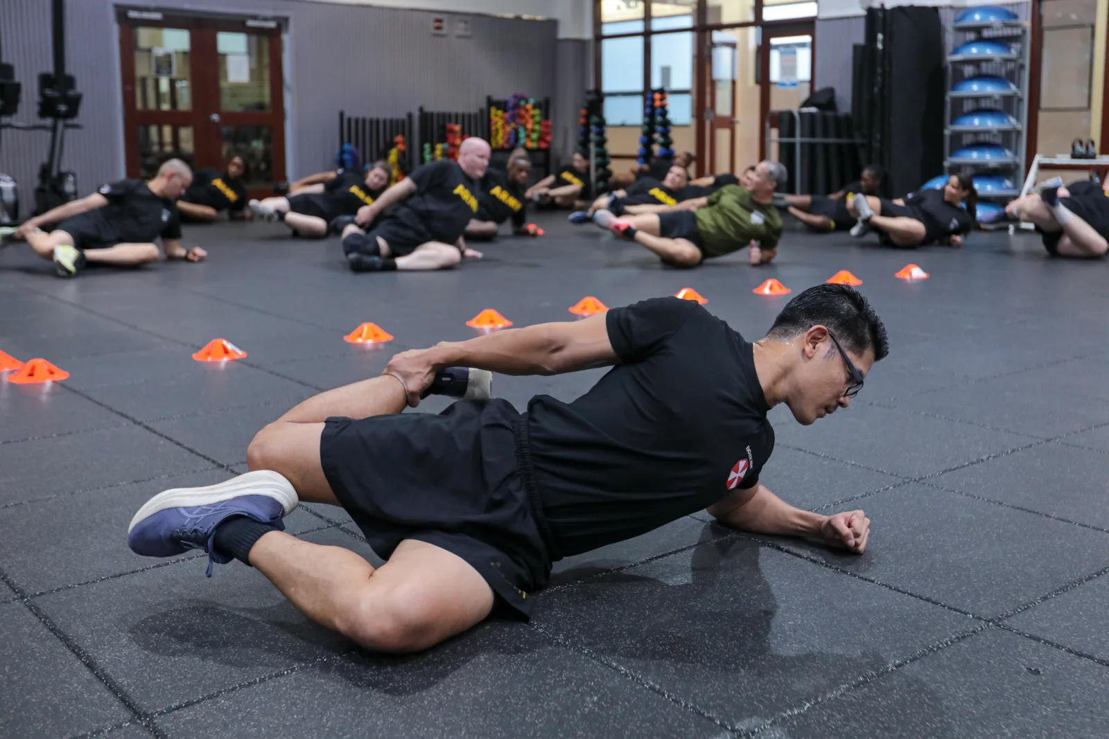 U.S. Army Soldiers of Eighth Army execute the thigh stretch at Collier Community Fitness Center, South Korea, Sept. 25, 2025. Soldiers conducted physical training to enhance esprit de corps and maintain physical fitness. (U.S. Army photo by KSGT. Geon Ho Lee)