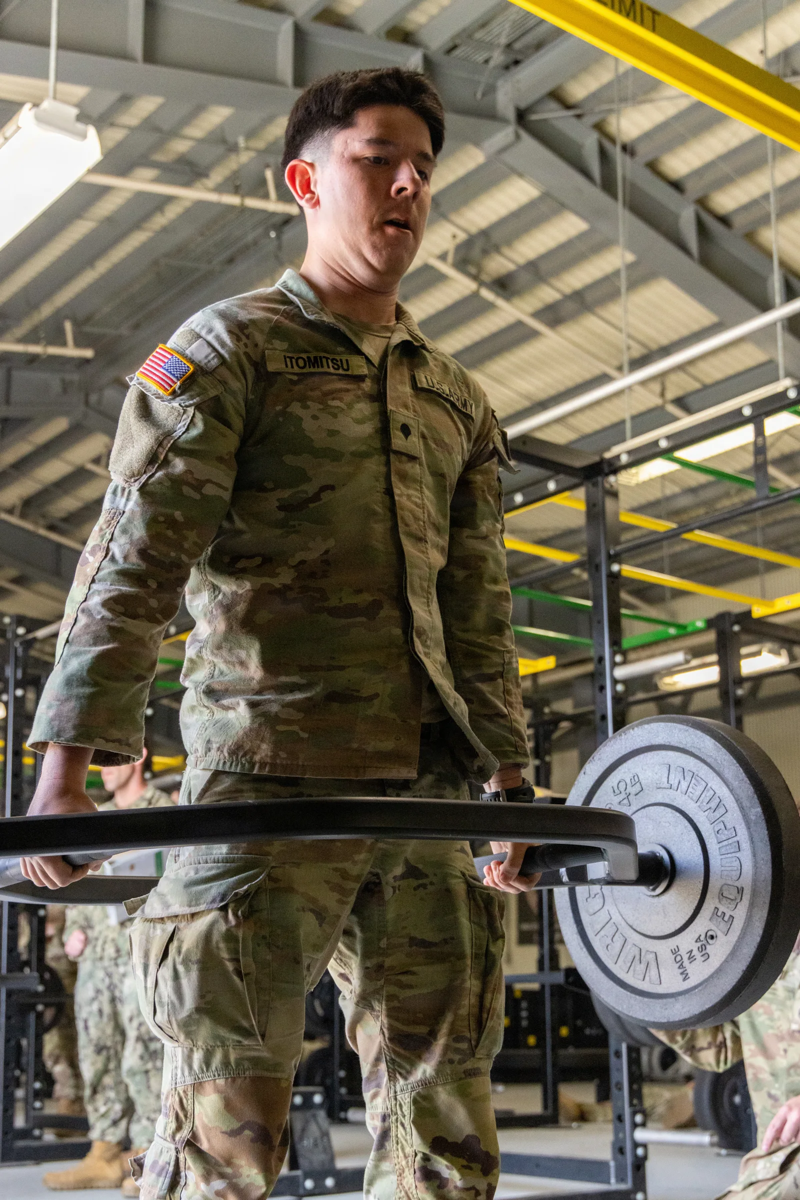 U.S. Army Spc. Matthew Itomitsu, a military working dog handler assigned to Combined Military Working Dog Detachment-Korea, performs a deadlift during the 2026 Combined Joint Military Working Dog Competition on Camp Humphreys, South Korea, April 23, 2026. The competition tests both canines and their handlers from across the U.S. Army Pacific in a series of challenges. (U.S. Army photo by Sgt. Joseph Liggio)