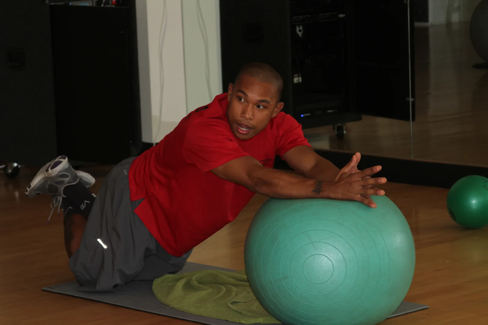 Gene Calantoc, Semper Fit personal trainer, uses a pilates ball during an abs class at the Marine Corps Recruit Depot San Diego Semper Fit Center Oct. 6 . Calantoc leads participants through a variety of abdominal exercises using different equipment, like medicine balls and weights, to target different core muscles. The class is held Monday through Thursday at the Semper Fit center.