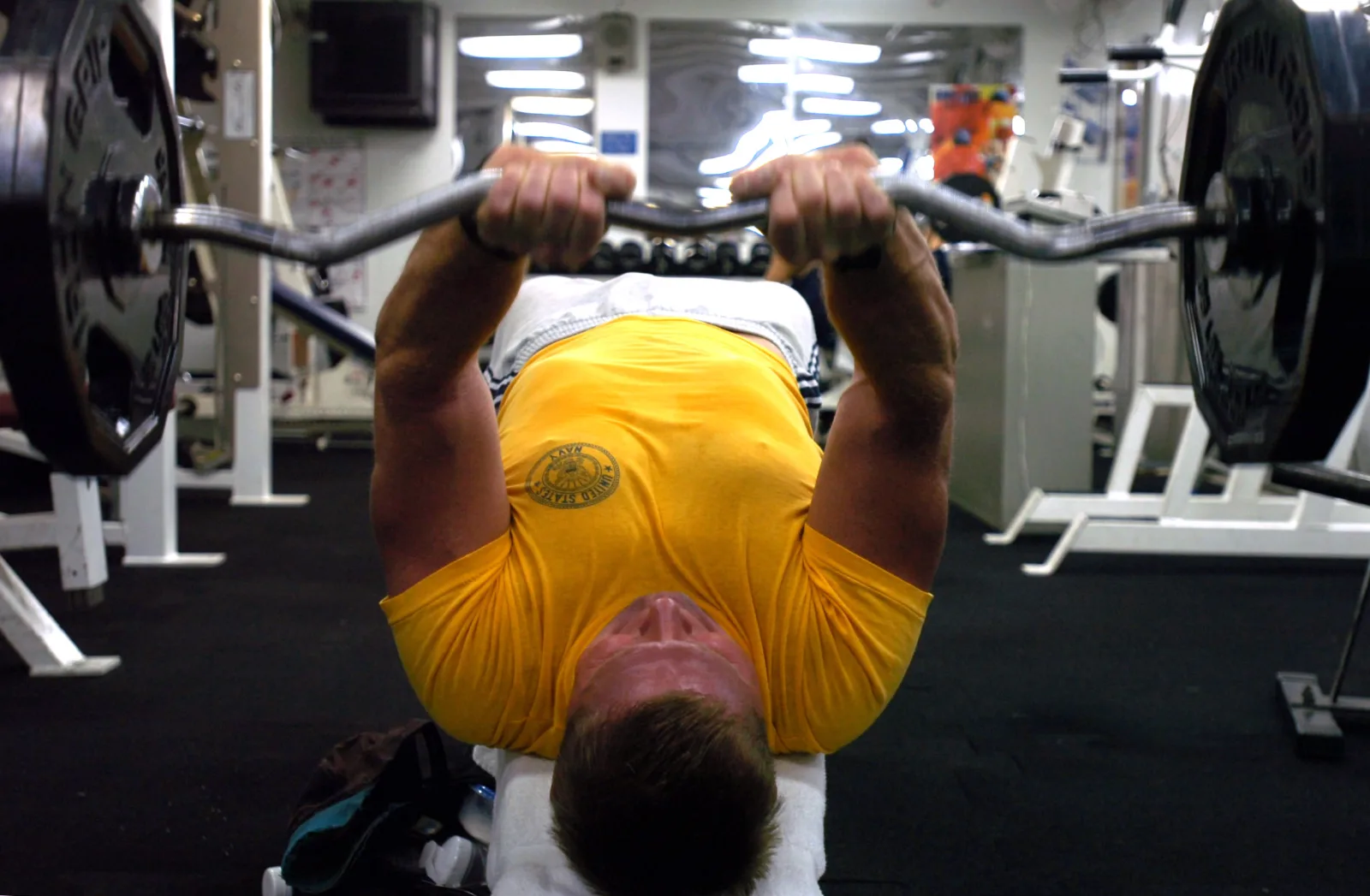 Pacific Ocean (Nov. 16, 2006) - Cmdr. Scott Parvin lifts weights in one of the four gyms aboard the Nimitz-class aircraft carrier USS Ronald Reagan (CVN 76). Ronald Reagan is currently underway, conducting routine carrier operations in the southern California operating area. U.S. Navy photo by Mass Communication Specialist 3rd Class Christopher Blachly (RELEASED)