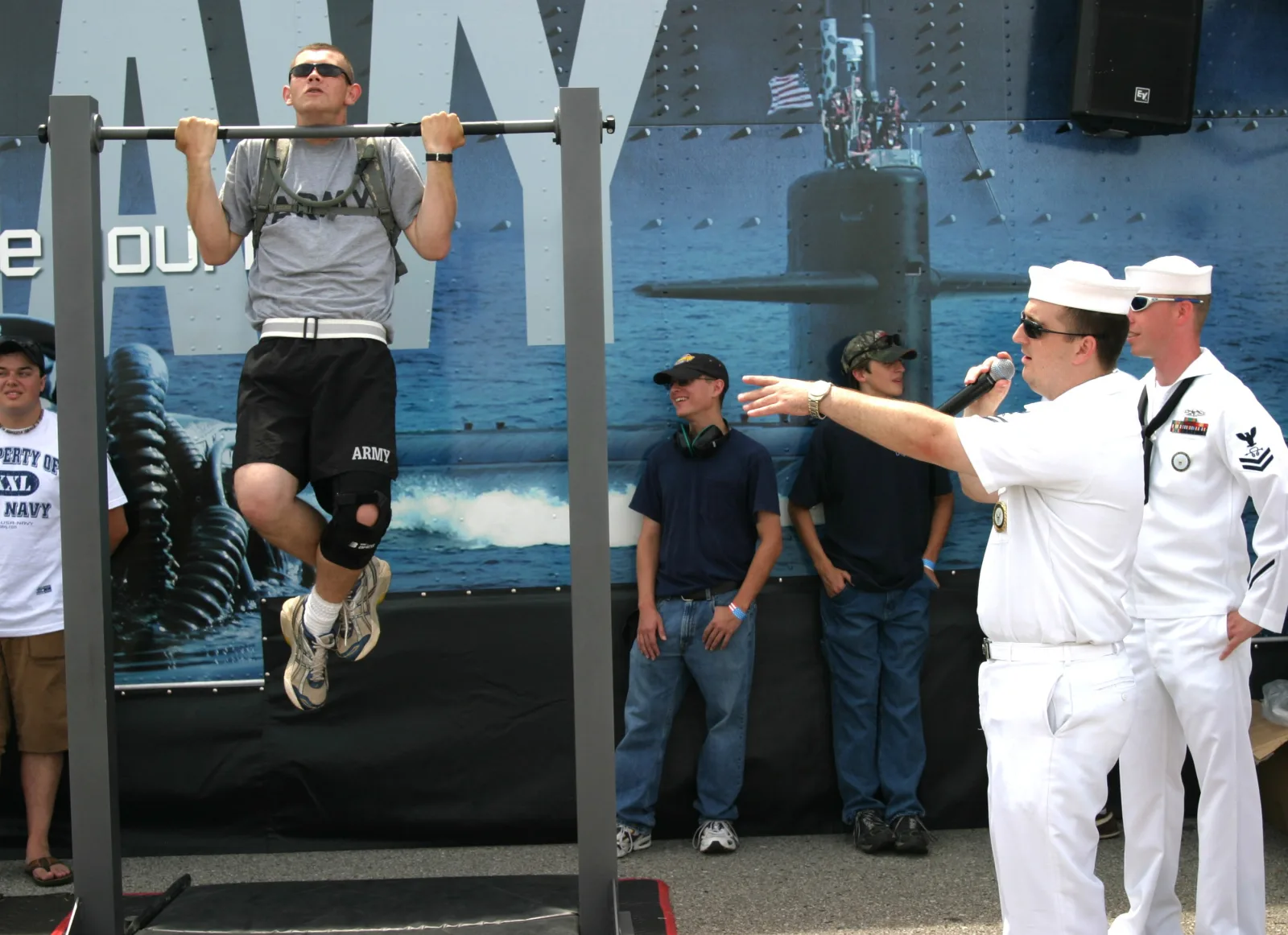 HUNTSVILLE, Ala. (June 28, 2008) Culinary Specialist 2nd Class Stanley Campbell encourages community members to do pull-ups on the Navy pull-up bar at the Huntsville International Airport Air Show. The pull-up bars were on display for the public to try as part of the Navy Accelerate Your Life Experience. U.S. Navy photo by Mass Communication Specialist 1st Class Kimberly DeJong (Released)