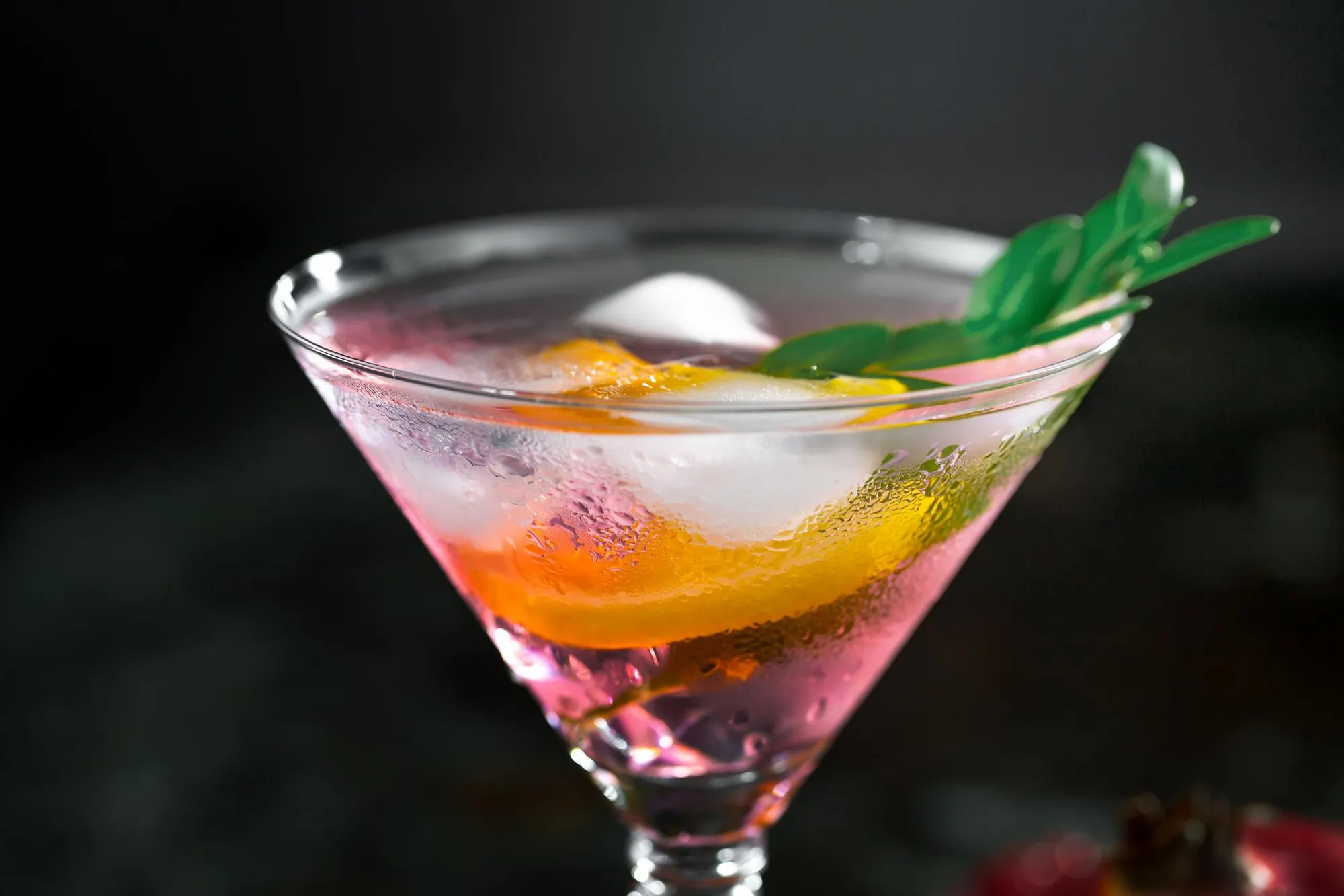 Alcoholic cocktail with fruit and ice